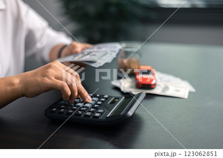 Finance bank tax expense accounting budget money businessman hand for Business expense analysis saving use car Financial calculate accountant close up calculator with graph chart write office desk Finance bank tax expense accounting budget money businessman hand for Business expense analysis saving use car Financial calculate accountant close up calculator with graph chart write office desk 123062851