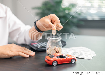 Finance bank tax expense accounting budget money businessman hand for Business expense analysis saving use car Financial calculate accountant close up calculator with graph chart write office desk 123063258