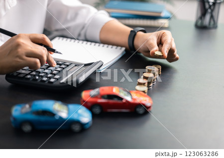 Finance bank tax expense accounting budget money businessman hand for Business expense analysis saving use car Financial calculate accountant close up calculator with graph chart write office desk 123063286