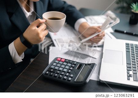 Finance bank tax expense accounting budget money businessman hand use calculator Financial calculate accountant close up calculator with graph chart write office desk Business expense analysis saving Finance bank tax expense accounting budget money businessman hand use calculator Financial calculate accountant close up calculator with graph chart write office desk Business expense analysis saving 123063291