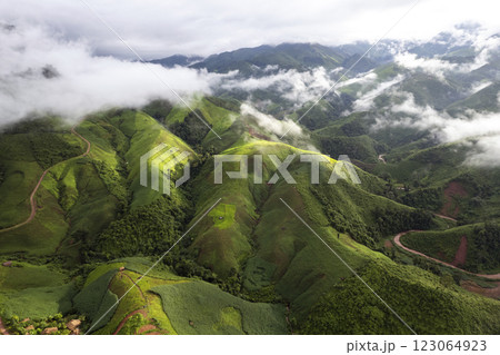 Top view Landscape of Morning Mist with Mountain Layer at north of Thailand. mountain ridge and clouds in rural jungle bush forest Top view Landscape of Morning Mist with Mountain Layer at north of Thailand. mountain ridge and clouds in rural jungle bush forest 123064923