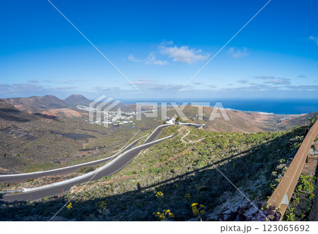 Scenic View of Lanzarote s Serpentine Roads and Coastline 123065692