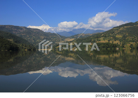 Lamjung Himal reflecting in Lake Begnas, Nepal. 123066756