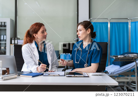 Healthcare professionals collaborating with technology for diagnosis. Healthcare professionals collaborating with technology for diagnosis. 123070211