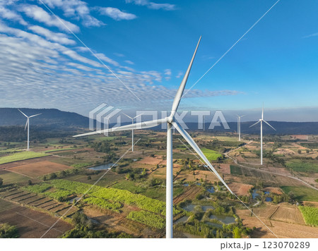 Wind energy and sustainable power generation with wind turbines, Eco-friendly solutions for renewable resources. Wind power farm and sustainable development of renewable energy, green technology. 123070289