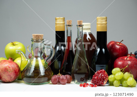 Different types of vinegar, apple, balsamic, wine and pomegranate vinegars in bottles Different types of vinegar, apple, balsamic, wine and pomegranate vinegars in bottles 123071490