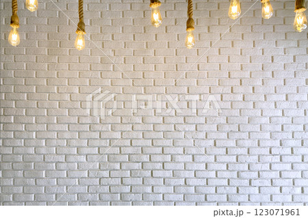 White Brick Wall with Burning Glass Light Bulbs White Brick Wall with Burning Glass Light Bulbs 123071961