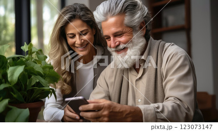 Modern Elderly Couple Embracing Digital Age with Smiles Modern Elderly Couple Embracing Digital Age with Smiles 123073147