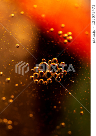 Oil in water, abstract background in golden tones Oil in water, abstract background in golden tones 123073473