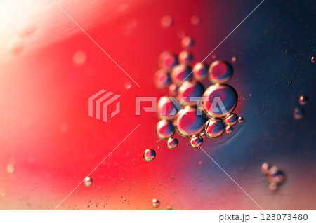 Oil in water, abstract background in blue and red color tones 123073480