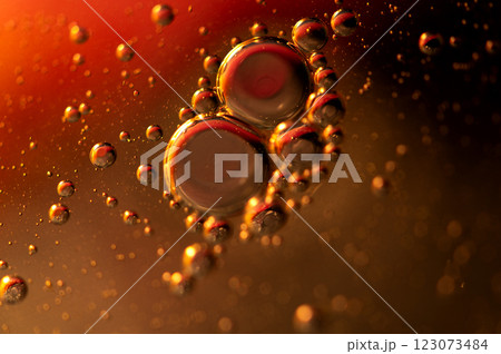 Oil in water, abstract background in golden and red color tones Oil in water, abstract background in golden and red color tones 123073484