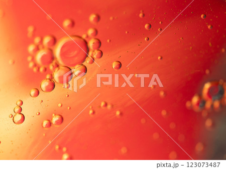 Oil in water, abstract background in yellow and red color tones 123073487