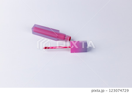 Stylish Pink Lip Gloss Bottle with Applicator on a Clean Surface Perfect for Beauty Enthusiasts and Makeup Lovers Looking to Add a Pop of Color to Their Look Stylish Pink Lip Gloss Bottle with Applicator on a Clean Surface Perfect for Beauty Enthusiasts and Makeup Lovers Looking to Add a Pop of Color to Their Look 123074729