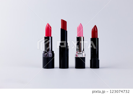 A Stunning Display of Four Vibrant Lipsticks in Various Shades for Makeup Lovers Seeking the Perfect Pout and Colors for Every Occasion 123074732