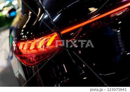 Modern backlights of the car. The headlight of modern prestigious car close-up. Beautiful headlights of a car. Modern backlights of the car. The headlight of modern prestigious car close-up. Beautiful headlights of a car. 123075641