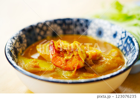 Traditional Thai sour and spicy curry with shrimp called Kang Som Goong is a healthy, sour and spicy food from the South of Thailand. It is curry without coconut milk. 123076235