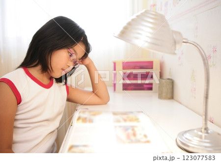 asian little girl studying at home asian little girl studying at home 123077583
