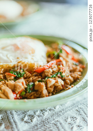 Stir Fried Basil Chicken , Fried Egg with Rice 123077716
