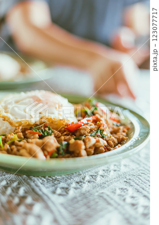 Stir Fried Basil Chicken , Fried Egg with Rice 123077717