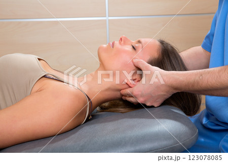facial reflexology doctor hands in woman face 123078085