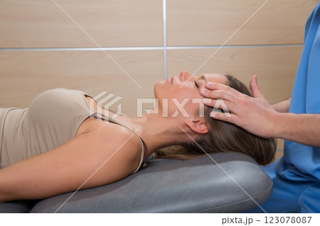facial reflexology doctor hands in woman face 123078087