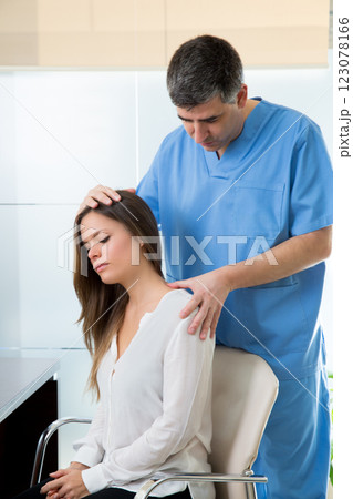 physiotherapist doing myofascial therapy on woman patient physiotherapist doing myofascial therapy on woman patient 123078166