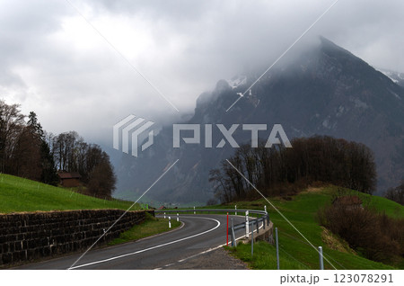 Winding mountain road in Canton of St. Gallen, Glarus Alps region, Switzerland, Europe. Winding mountain road in Canton of St. Gallen, Glarus Alps region, Switzerland, Europe. 123078291