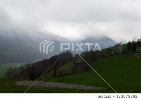 Switzerland landscape with misty mountain 123078292