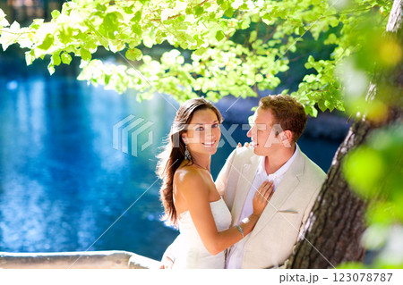 couple in love hug in forest tree blue lake 123078787