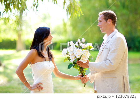 couple just married with man holding flowers 123078825