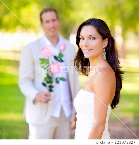 couple just married with man holding flowers 123078827