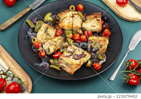Baked mackerel stuffed with vegetables. Baked mackerel stuffed with vegetables. 123079402