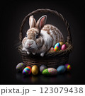Cute rabbit is sitting on a basket of Easter painted eggs on a dark background 123079438