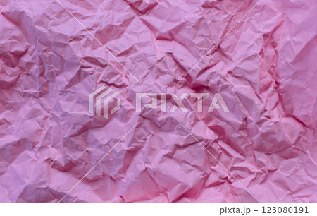 Wrinkled or crumpled pink paper texture used as a white paper background texture in design Wrinkled or crumpled pink paper texture used as a white paper background texture in design 123080191