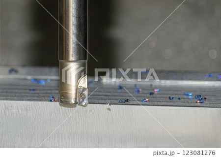 Close up scene the CNC milling machine rough cutting the injection mold parts by indexable tools. Close up scene the CNC milling machine rough cutting the injection mold parts by indexable tools. 123081276