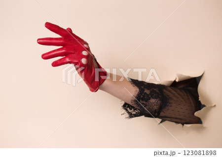 Beautiful hand in a red car leather glove 123081898