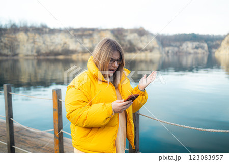Young caucasian woman sending message using smartphone annoyed and frustrated shouting with anger, crazy and yelling with raised hand, anger concept 123083957