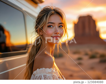 Young woman posing near Monument Valley at sunset 123084080