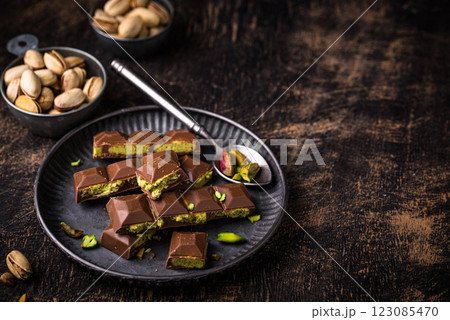 Dubai chocolate with kadayif pistachio filling Dubai chocolate with kadayif pistachio filling 123085470