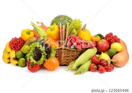 Healthy fresh vegetables and fruits in willow basket isolated on white 123085496