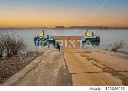 River Danube banks and empty ferry terminal pier in Romania. River Danube banks and empty ferry terminal pier in Romania. 123086088
