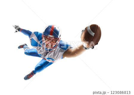 Athlete in a jump. Epic sport. American football. Player catches the ball and flies in the air. Sport emotion. Sportsman in action. Isolated 123086813