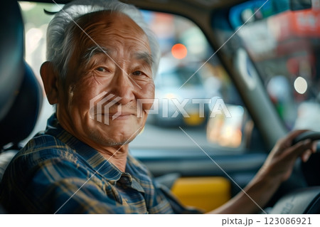 A smiling elderly man driving a vehicle, embodying wisdom and experience in life. A smiling elderly man driving a vehicle, embodying wisdom and experience in life. 123086921