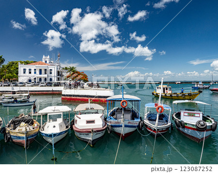 Colorful fishing boats moored in the Port of Salvador, with capitania dos portos in the background 123087252