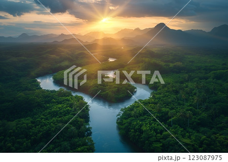 A breathtaking sunrise over a winding river surrounded by lush green mountains. 123087975