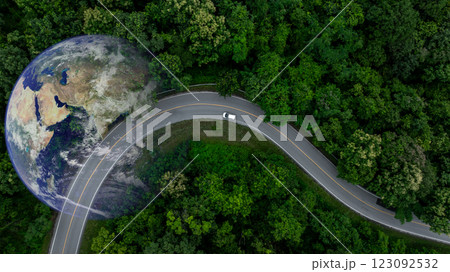 Aerial view EV electric vehicle car on middle green tree forest road globe earth planet, EV car electric vehicle car alternative sustainable energy eco power, Green business ecosystem environment. Aerial view EV electric vehicle car on middle green tree forest road globe earth planet, EV car electric vehicle car alternative sustainable energy eco power, Green business ecosystem environment. 123092532
