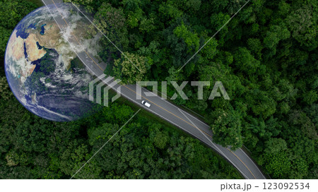 Aerial view EV electric vehicle car on middle green tree forest road globe earth planet, EV car electric vehicle car alternative sustainable energy eco power, Green business ecosystem environment. Aerial view EV electric vehicle car on middle green tree forest road globe earth planet, EV car electric vehicle car alternative sustainable energy eco power, Green business ecosystem environment. 123092534