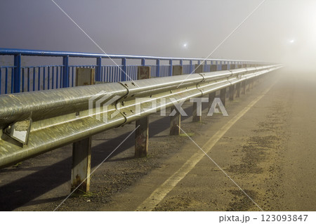 Thick fog over empty road at night Thick fog over empty road at night 123093847