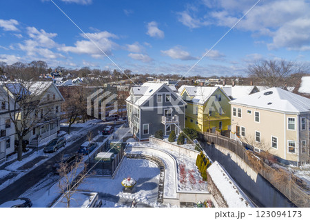 Moving clouds over the Houses and buildings at Porter Square area in Cambridge, MA on a cold and sunny winter morning in February 123094173