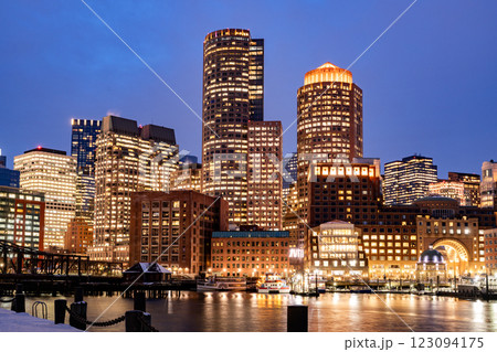 View of Boston downtown skyscrapers seen from Fan Pier Park on a cold cloudy winter night View of Boston downtown skyscrapers seen from Fan Pier Park on a cold cloudy winter night 123094175